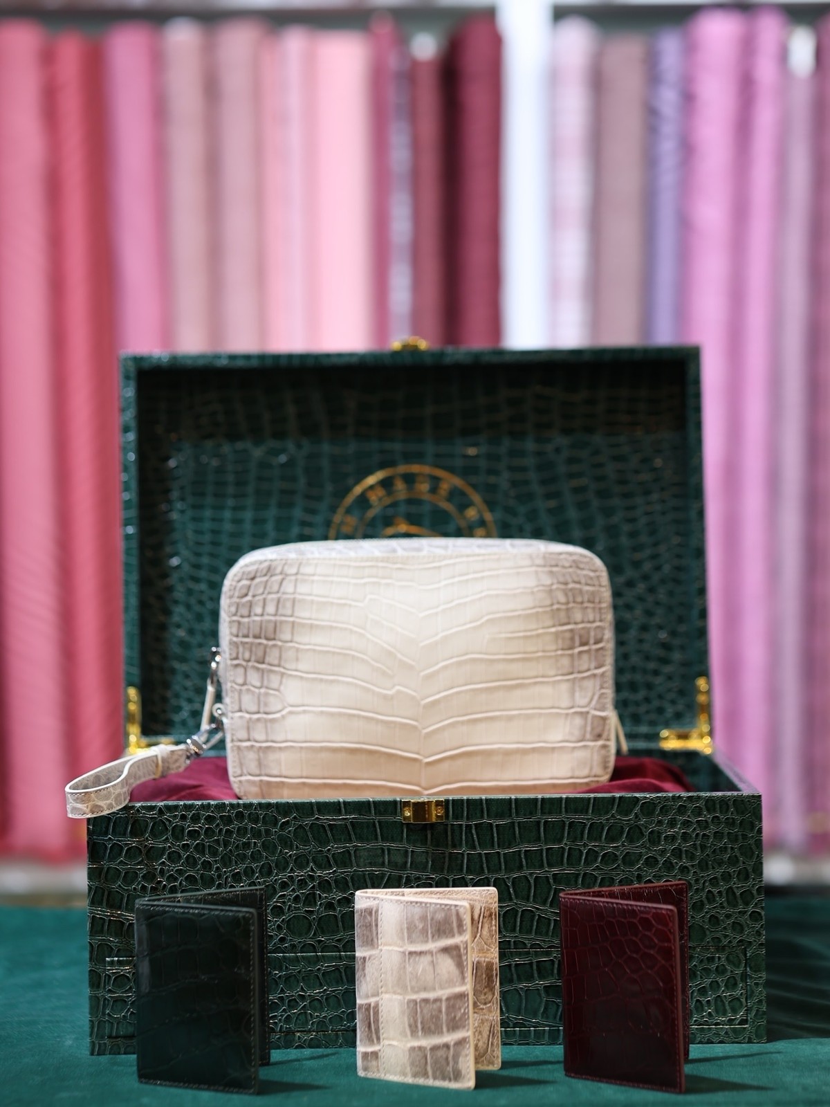 A crocodile day bag in its case